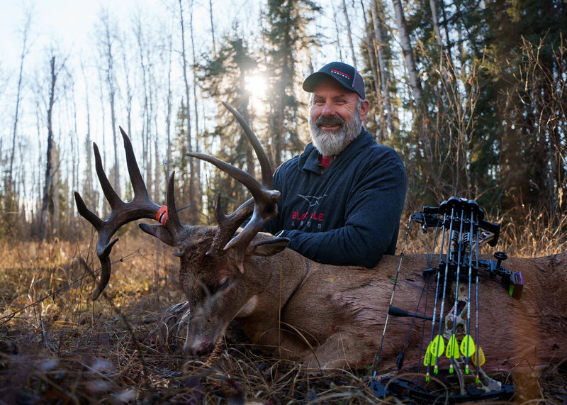 Black Eagle Arrows hunter with trophy buck and bow